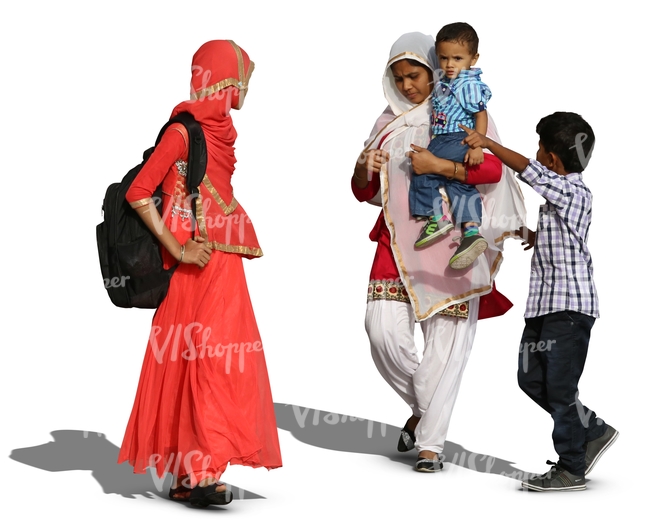 two hindu women with two boys walking