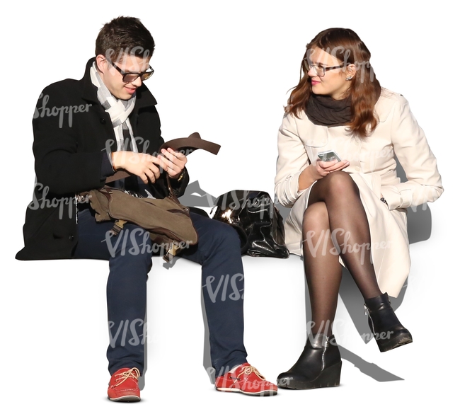 man and woman wearing autumn coats sitting and talking