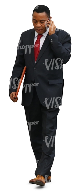 cut out black businessman walking while talking on the phone