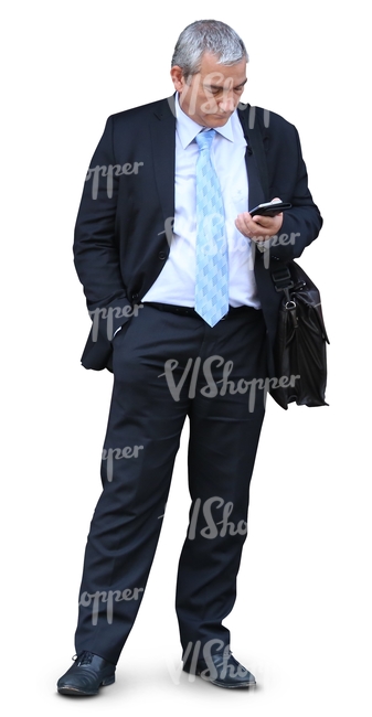 cut out elderly businessman standing and looking at his phone