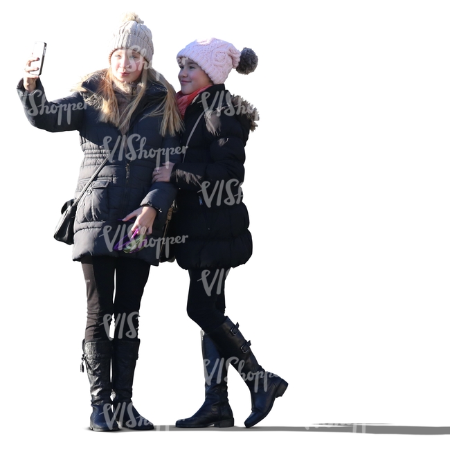 two girls in winter coats taking a selfie