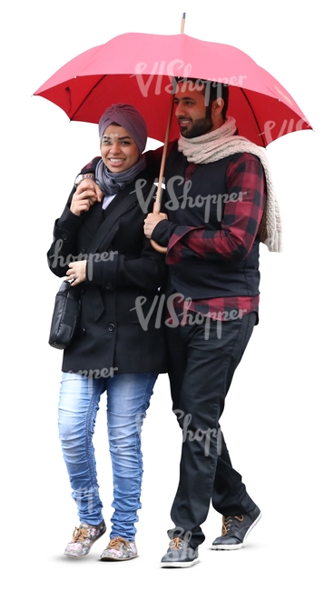 smiling man and woman walking under red umberella