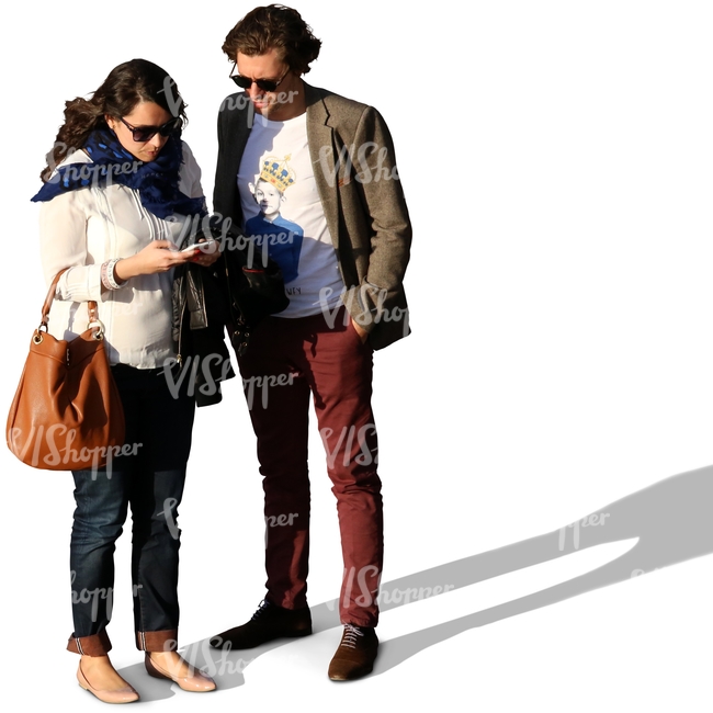 a couple standing and looking at the phone