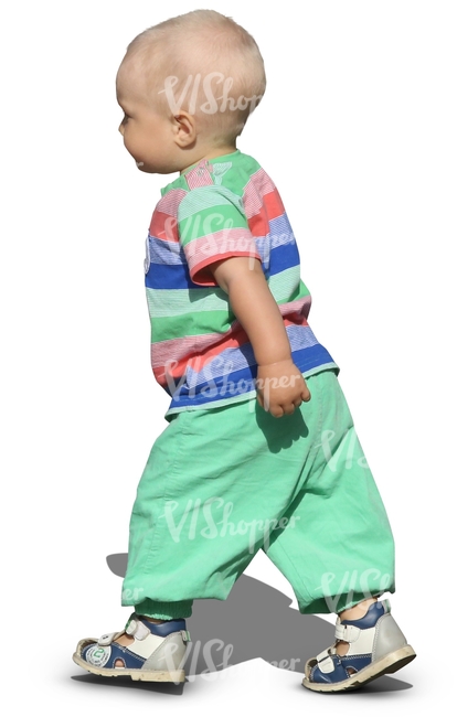 toddler in green trousers walking
