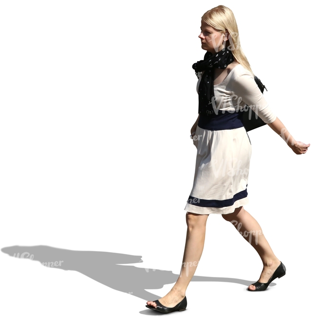 blond woman in a dress walking