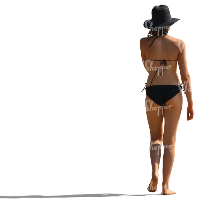 woman wearing a black hat and bikini walking on the beach
