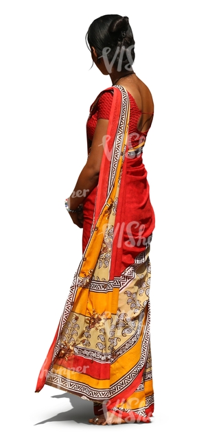 Indian woman wearing a colorful red sari standing