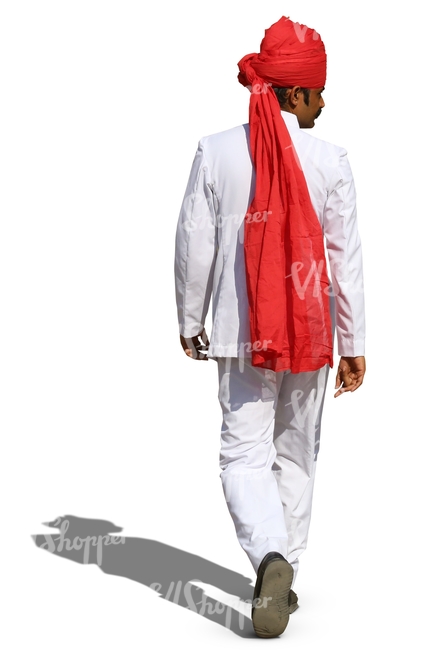 hindu man with a red turban and wearing a white suit walking 