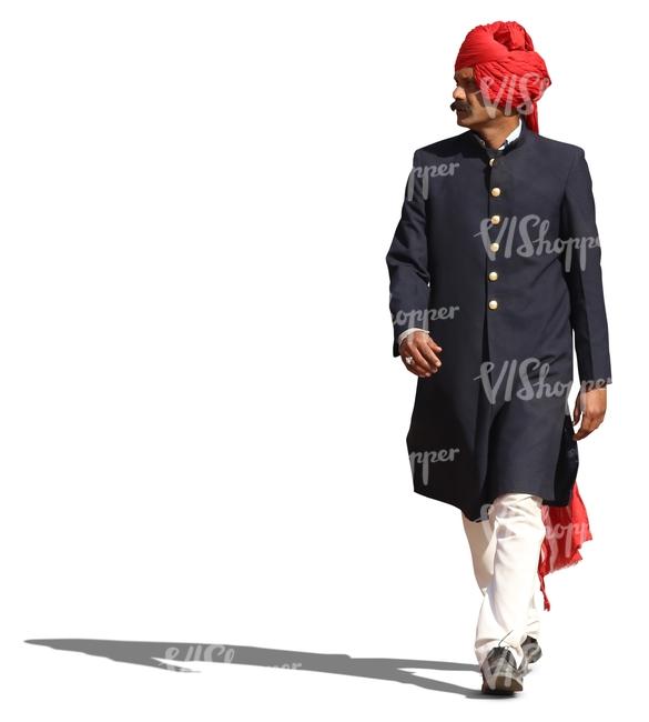hindu man in a traditional attire and wearing a turban walking