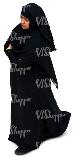 muslim woman in a black abaya walking