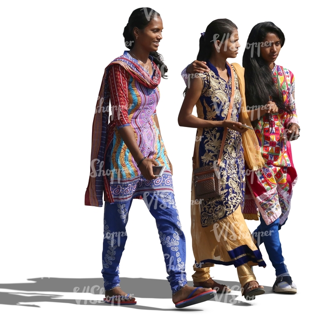 three young hindu women wearing traditional indian clothes walking and talking