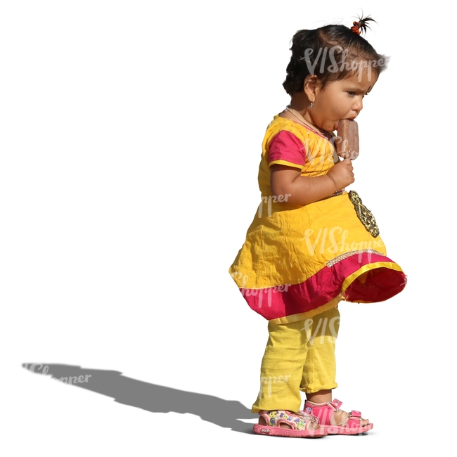 young indian girl standing and eating ice cream