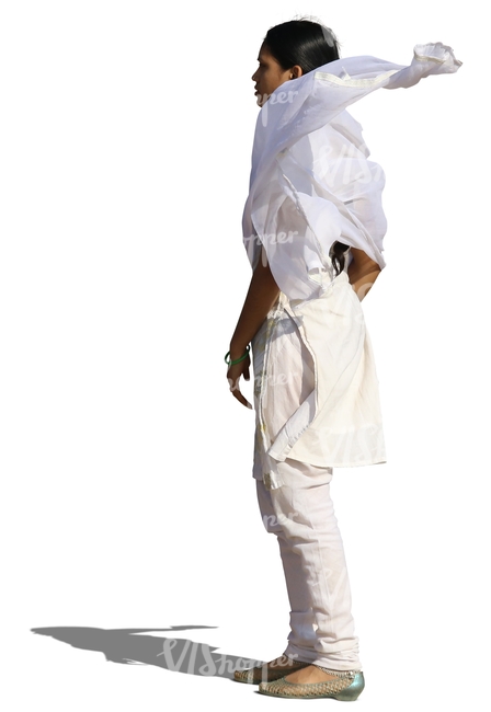 indian woman in a white salwa kameez standing in the wind