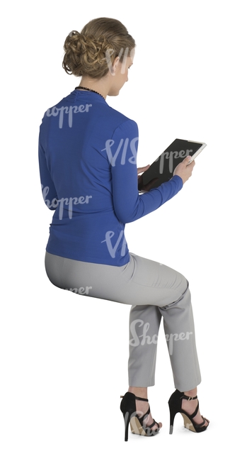 female office worker sitting and lookig at the ipad