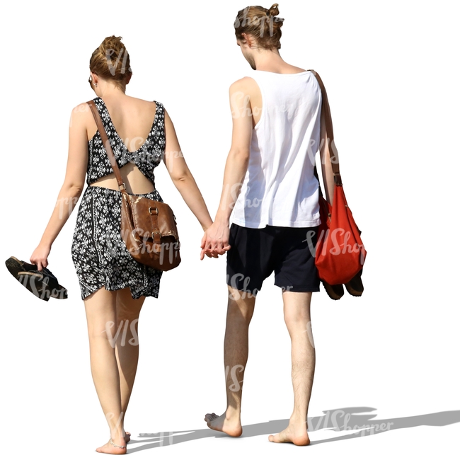 young couple walking barefoot and hand in hand