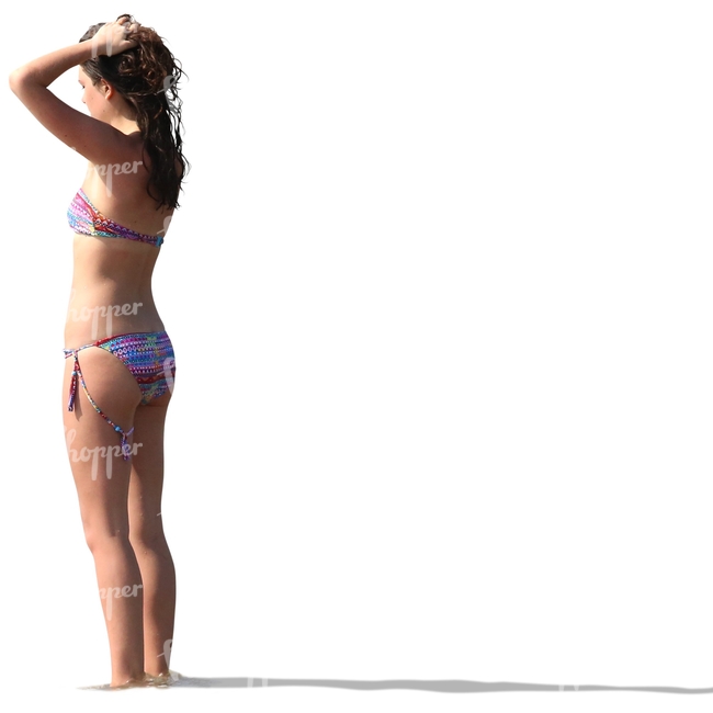 woman in a bikini standing in the water