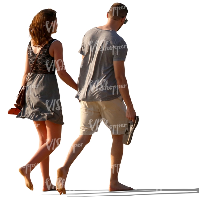 couple walking barefoot and holding hands