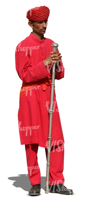 hindu man wearing a red suit and turban standing