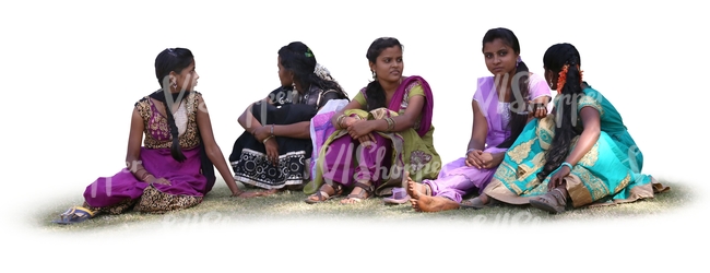 group of indian women sitting on the grass
