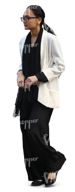 woman in a black and white outfit walking