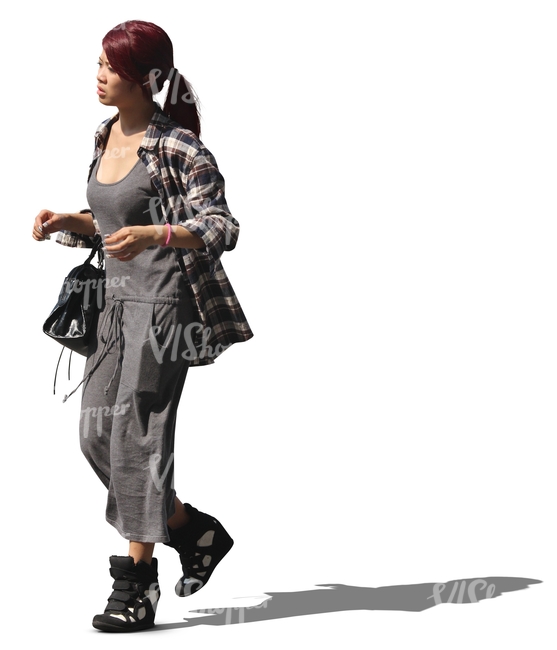 young asian woman with red hair walking