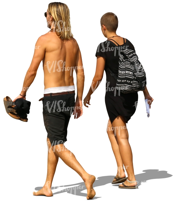 man and woman walking on the beach