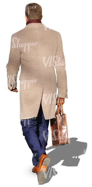 man in a beige coat walking with a suitcase
