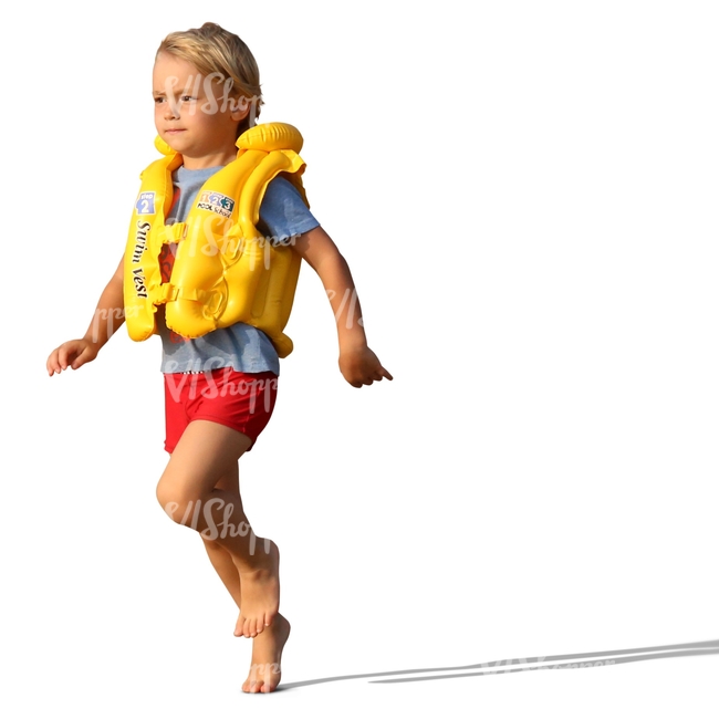 boy in a swim vest running on the beach