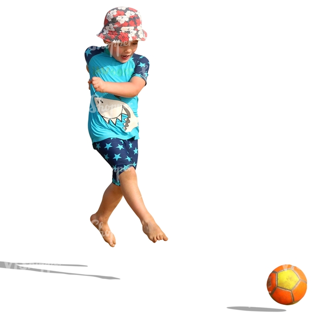 small boy playing with a ball on the beach