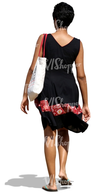 woman in a summer dress and flip-flops walking