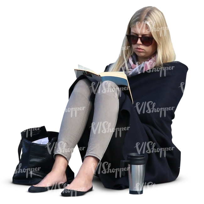 woman sitting and reading a book