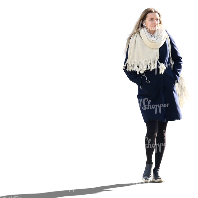 woman in a blue coat and white scarf walking