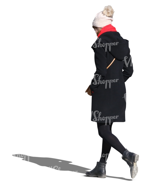 woman wearing a black coat and white hat walking