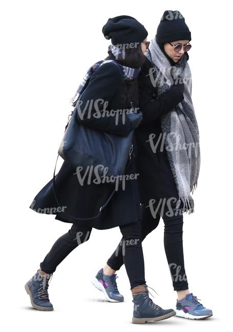 two women with large grey scarves walking side by side