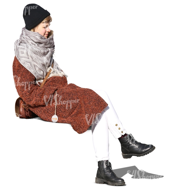 woman wearing a brown coat sitting in sunlight