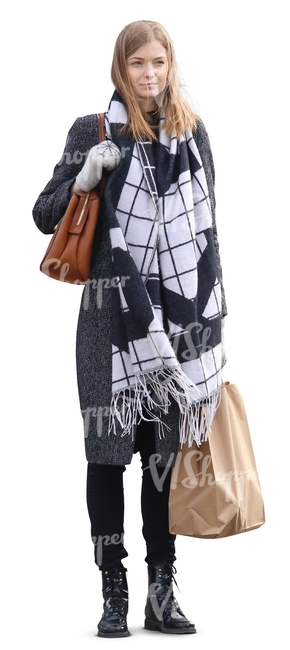 woman with a big scarf and a shopping bag standing
