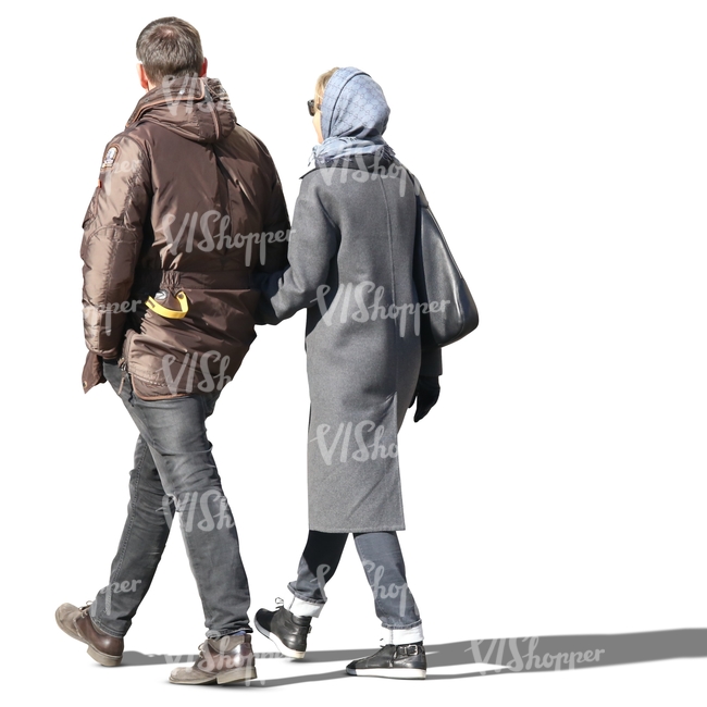 couple walking arm in arm in the autumn sun