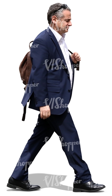 businessman with a leather backpack walking