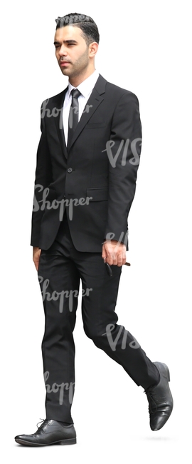 businessman in a black suit walking