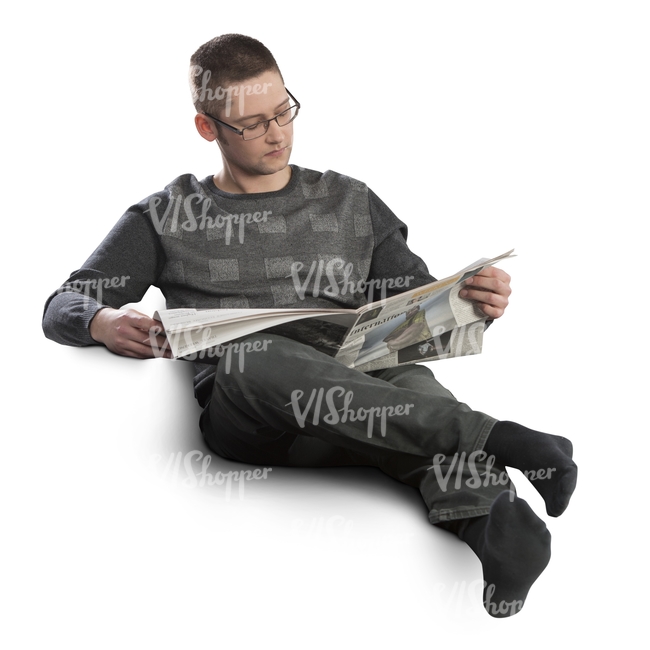 man sitting on a sofa and reading newspaper