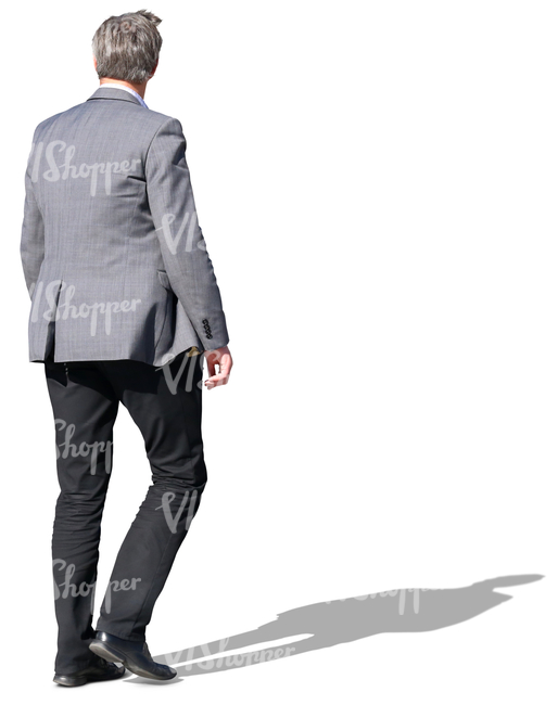 man in a grey jacket walking