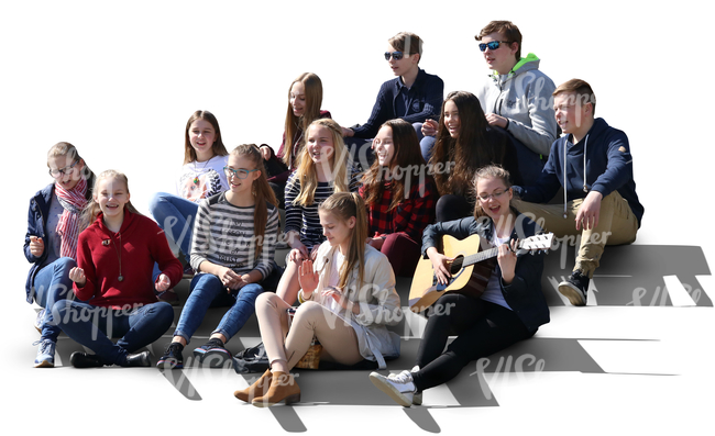 group of teenagers sitting on the stairs and singing