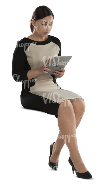 businesswoman sitting and working on her ipad