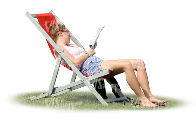 woman sitting in a sling chair and reading a magazine.