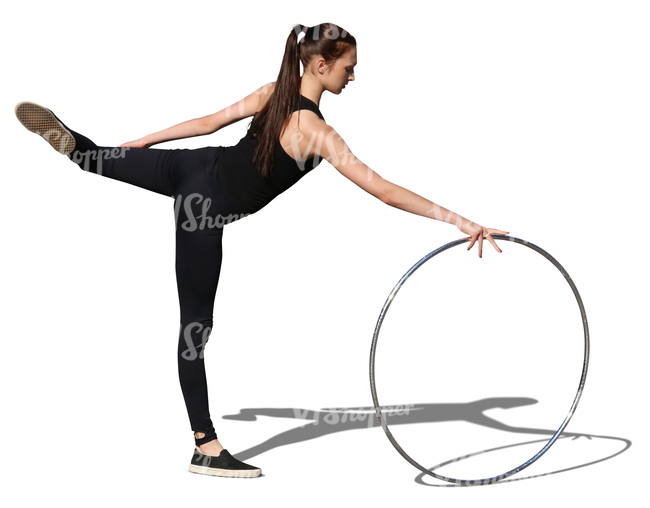 young gymnast performing with a hoop