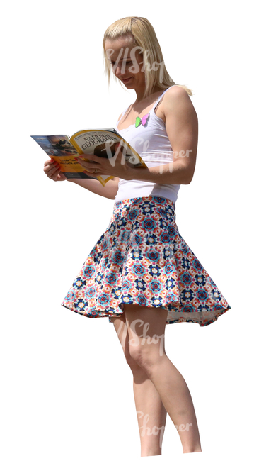 woman standing on a balcony and reading a magazine