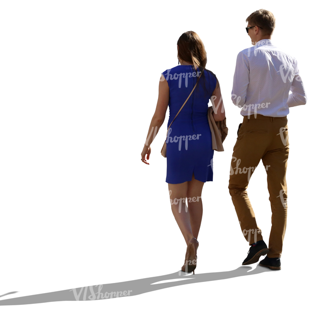 neatly dressed backlit couple walking side by side
