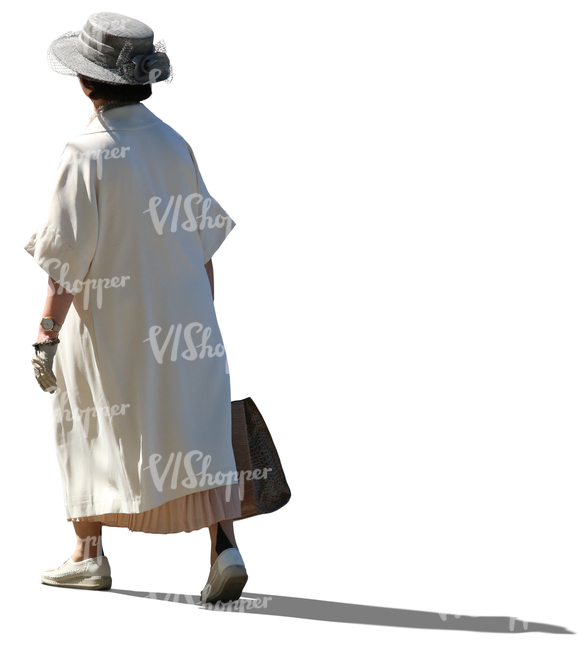 elderly lady in a white summer coat walking