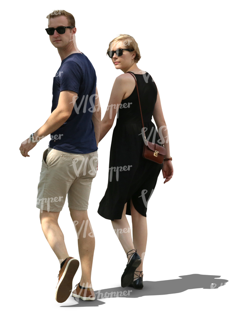 couple walking hand in hand in tree shade