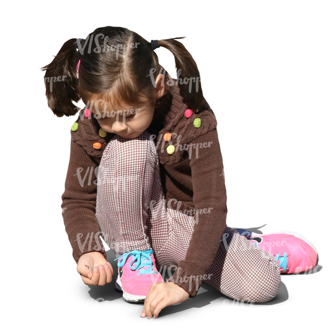 young asian girl playing on the ground